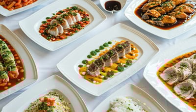 Freshly prepared catering dishes arranged artfully on a table Freshly prepared catering dishes arranged artfully on a table